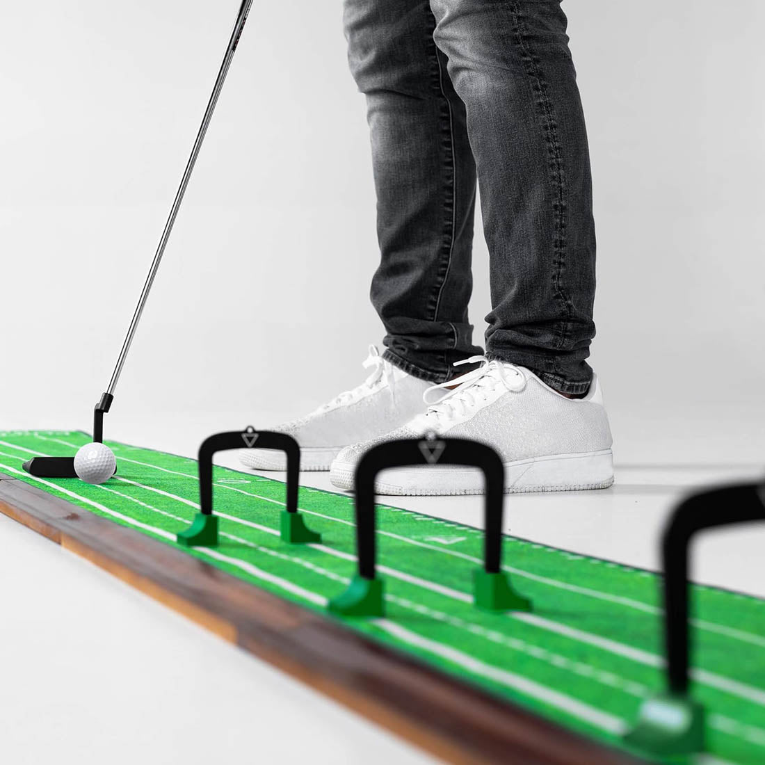 Putting through Perfect Practice gates on a putting mat